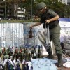 A national guard holds a bottle of molotov cocktail at Altamira square in Caracas