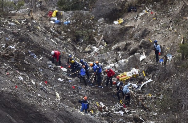 -- AFP PICTURES OF THE YEAR 2015 -- French gendarmes and investigators work on March 26, 2015 in the scattered debris on the crash site of the Germanwings Airbus A320 that crashed in the French Alps above the southeastern town of Seyne. The young co-pilot of the doomed Germanwings flight that crashed on March 24, appears to have 