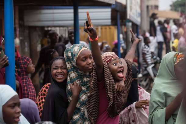 -- AFP PICTURES OF THE YEAR 2015 -- Hundreds of Nigerians celebrate at an intersection in the flashpoint northern city of Kaduna on March 31, 2015 the victory of main opposition All Progressives Congress (APC) presidential candidate Mohammadu Buhari. AFP PHOTO / NICHOLE SOBECKI