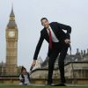 The world's shortest man Chandra Bahadur Dangi greets the tallest living man Sultan Kosen to mark the Guinness World Record's Day in London